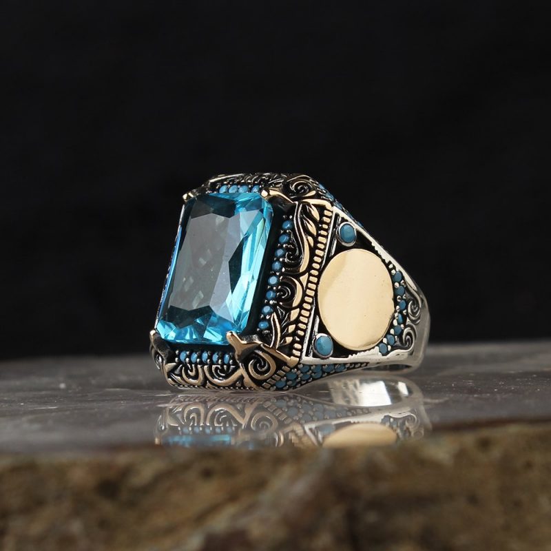 خاتم فضة عيار 925 مرصع بحجر التوباز الازرق بتصميم أنيق