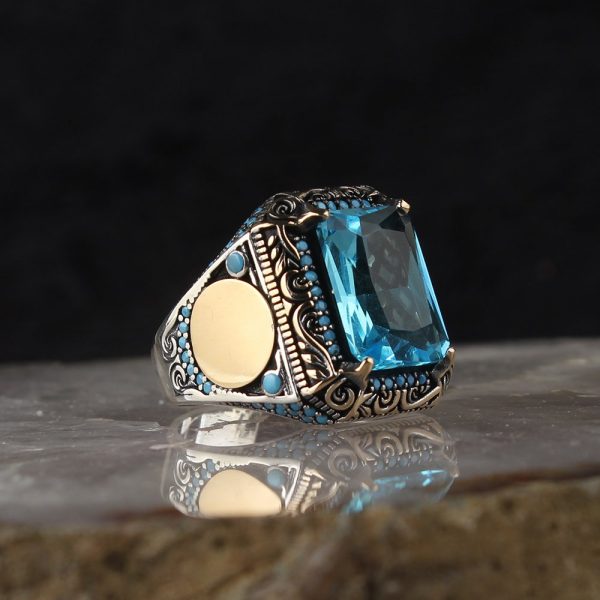 خاتم فضة عيار 925 مرصع بحجر التوباز الازرق بتصميم أنيق